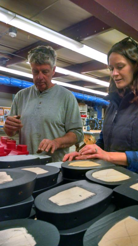Jim Jones, left, and Audrey Hodgdon review the next steps on the tugboat toys at a recent work session. MARGARET HOFFMAN/Boothbay Register