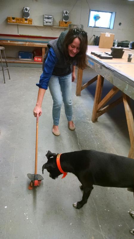 Audrey Hodgdon demonstrates a puffin toy for her dog Carter who also participates in the weekly work sessions where Hodgdon Yacht Services employees are building 150 wooden toys in partnership with Toys for Tots. MARGARET HOFFMAN/Boothbay Register