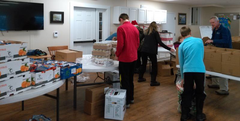 Some of the hardworking volunteers who filled Thanksgiving dinner boxes at Boothbay Region Food Pantry on Saturday morning, Nov. 17. JANE CARPENTER/Boothbay Register