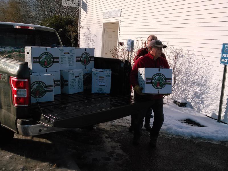 Volunteers unload trucks filled with Thanksgiving dinner items. JANE CARPENTER/Boothbay Register