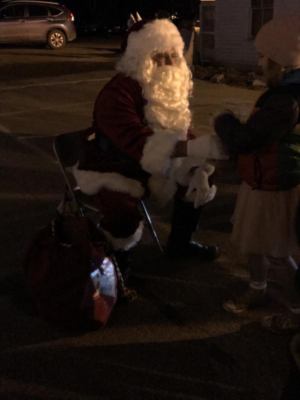Santa gives kids gifts. KELLIE BIGOS/Boothbay Register