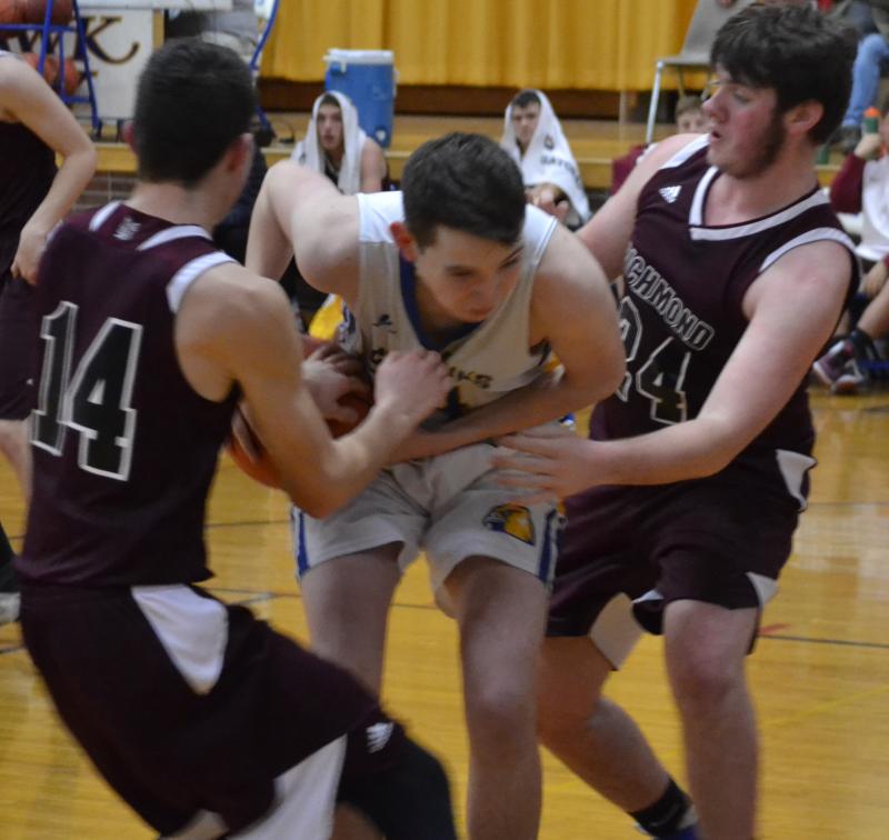 Boothbay sophomore Ben Pearce battles against two Richmond players Dec. 20 as the Seahawks rolled over the Bobcats, 63-34, at Porter Memorial Gymnasium. BILL PEARSON/Boothbay Register