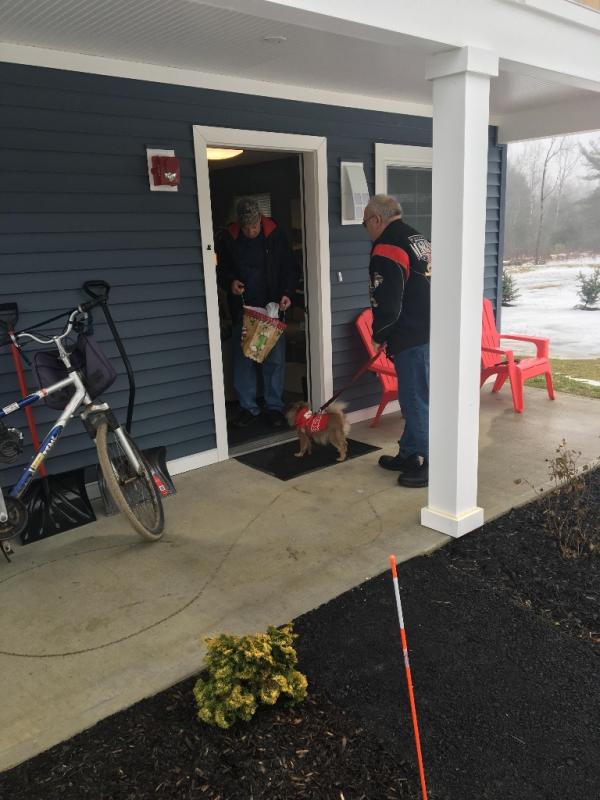 Daren Graves delivers a Rotary gift bag to veteran Robert "Bobby" Jones at Cabins in the Woods. Courtesy of Charlee Noble