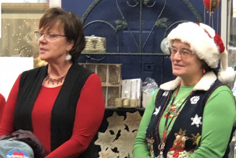 Southport Central School principal Lisa Clarke, left, and administrative assistant Eileen Higgins watch the schoolchildren sing Christmas songs at the Community Center Friday, Dec. 21. Courtesy of Jen Field