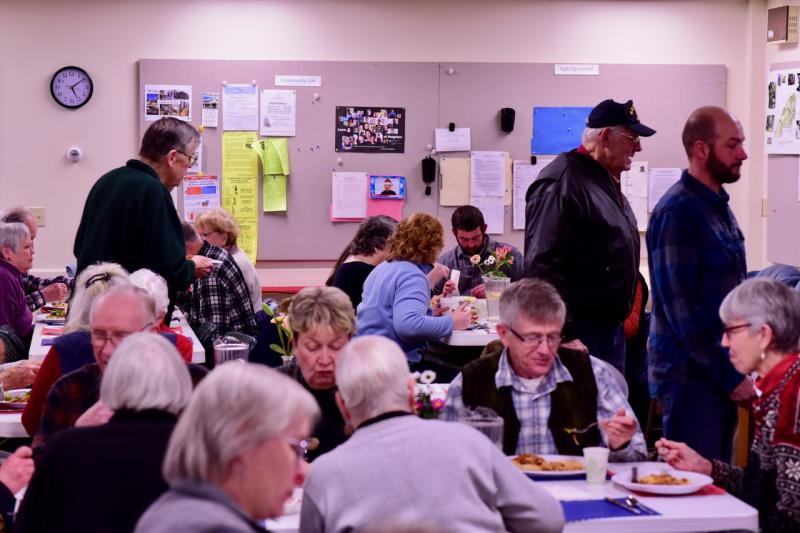 People enjoy the pasta dinner at the Congregational Church on Saturday, Jan. 19, a fundraiser for local Coast Guard families. Bob Crink photo