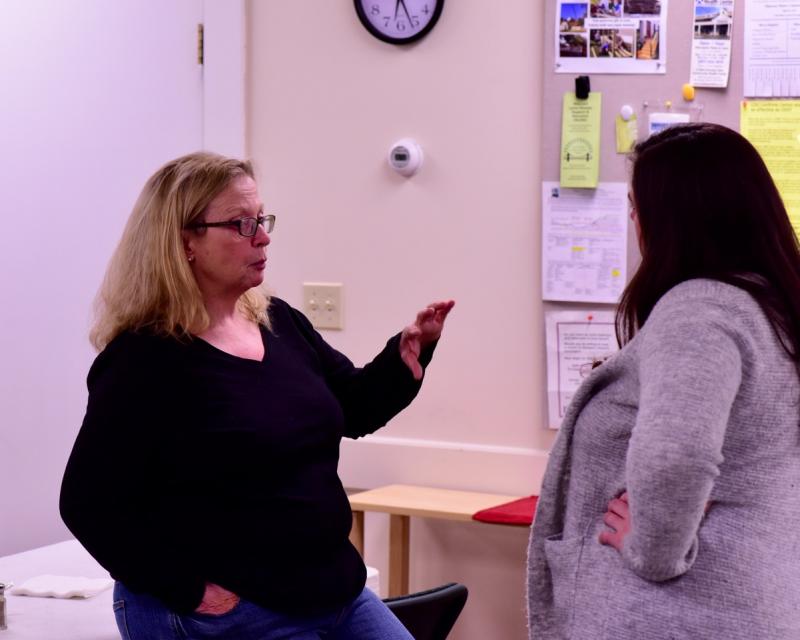 Rep. Holly Stover, left, talks with an unidentified woman at the supper. Bob Crink photo