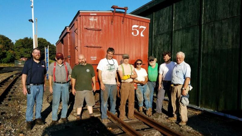 Volunteers from both the MNG and WW&F work together in the Portland yard to ready several box cars for the move to Alna last summer. Courtesy of Wesley Heinz
