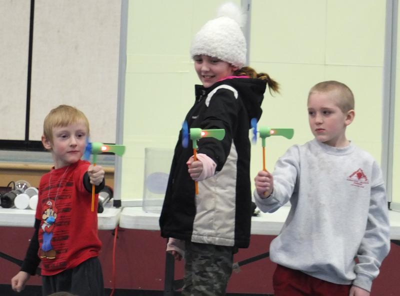 These elementary school students hold a pinwheel during a Jan. 15 Mad Science of Maine presentation about energy at Edgecomb Eddy School. BILL PEARSON/Boothbay Register