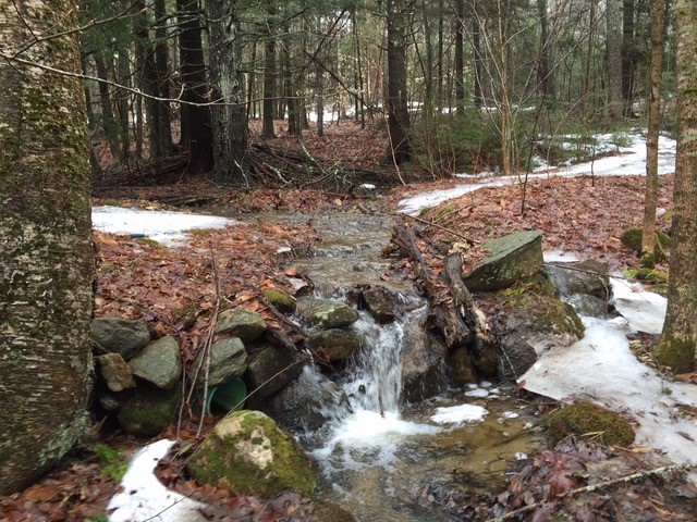 This is a before photo of a 2016 Clean Water Grant project. An eight-foot culvert wasn’t producing desired results because it was too small. The stream began cutting its way through the road and carrying dirt downstream to Adams Pond. Courtesy photo