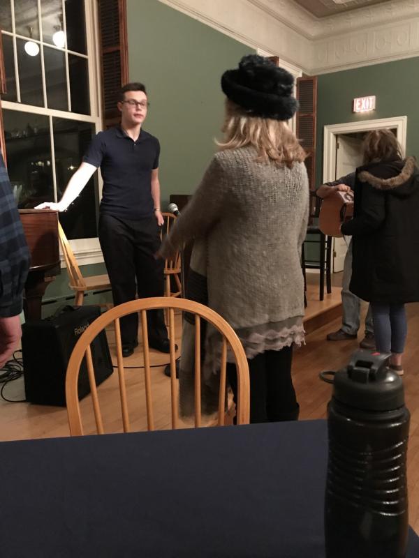 Benjamin Rumney sets up the sound system. KELLIE BIGOS/Boothbay Register