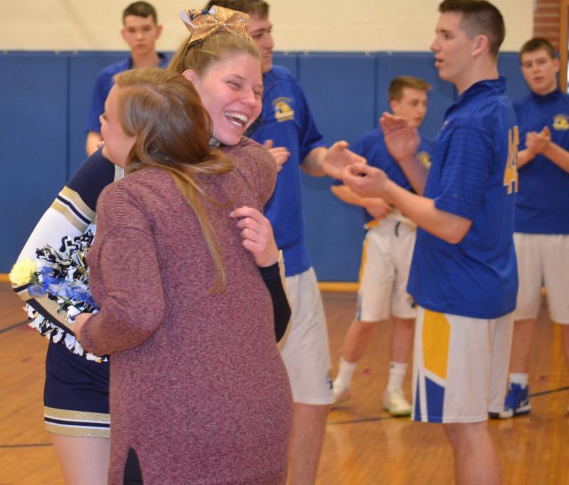 Seahawk cheerleader Natalia Gosselin hugs coach Elizabeth Tilton Feb. 6 during Senior Night as the school recognized students participating in their final winter co-curricular activity. BILL PEARSON/Boothbay Register