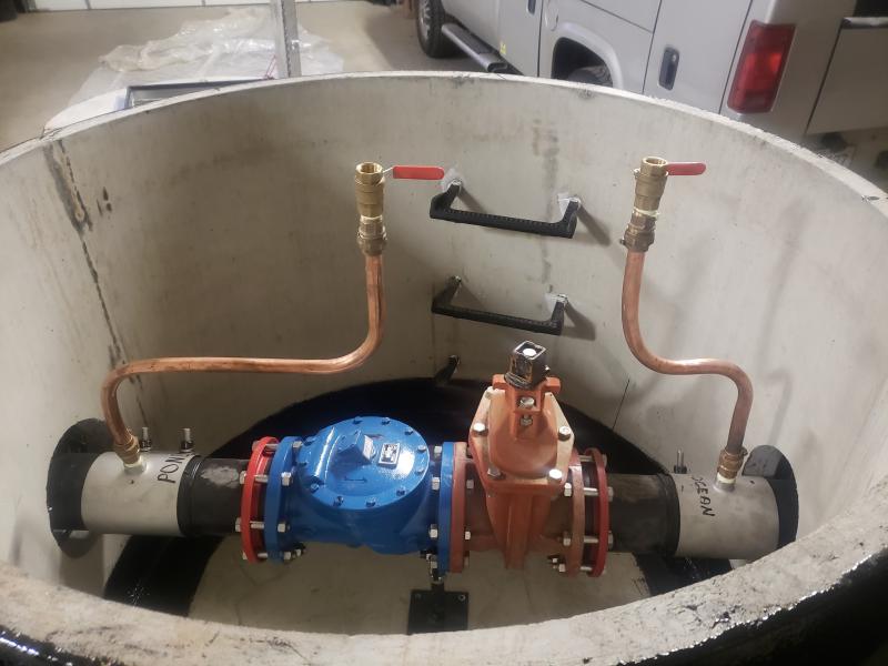 Controls for the siphon, showing a check valve (blue); a large ball valve (orange) and two small ball valves. Merritt Blakeslee photo