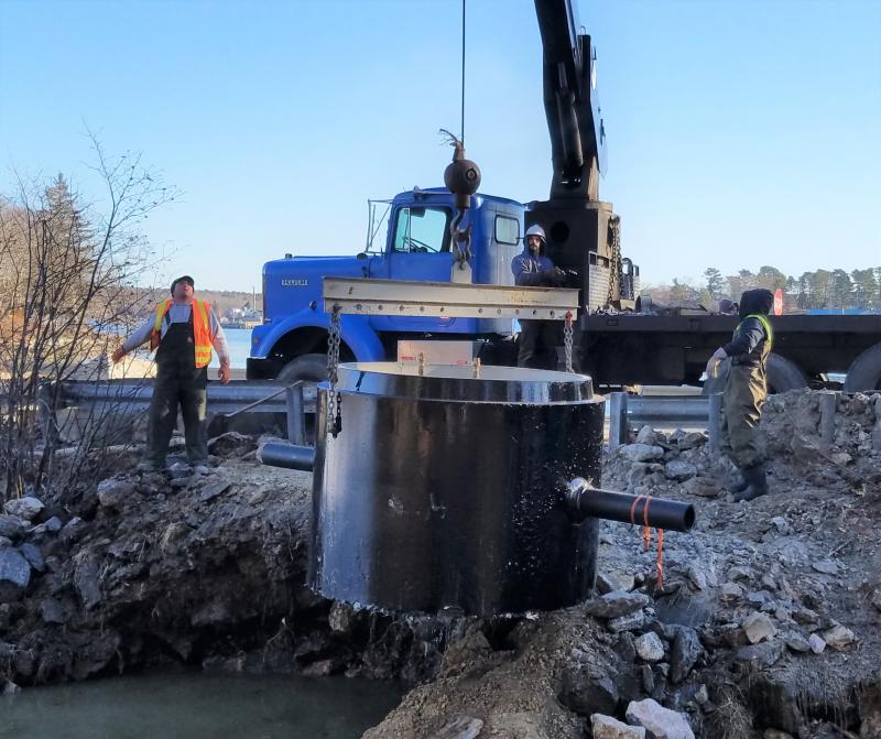 December 13, 2018: A crane lowers a manhole cylinder into place. Merritt Blakeslee photo