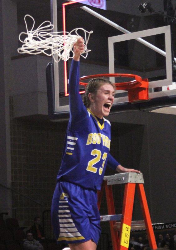 Faith Blethen swings the net following Boothbay’s state championship victory. STEVE EDWARDS/Boothbay Register