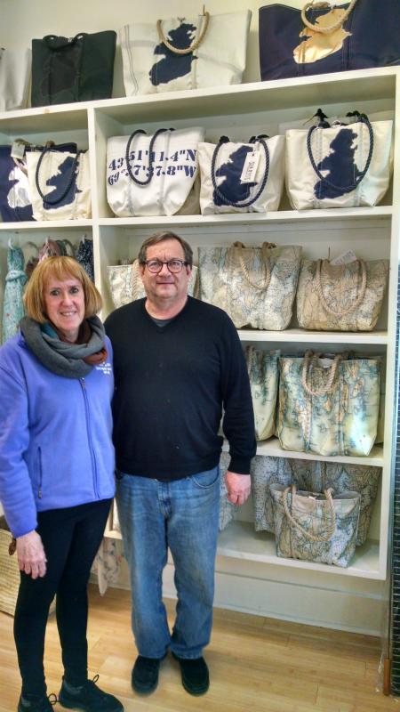 Sweet Bay owners Ken and Cathy Rayle pose with some of the exclusive Sea Bags products they will continue to carry in their shop on Townsend Avenue. MARGARET HOFFMAN/Boothbay Register