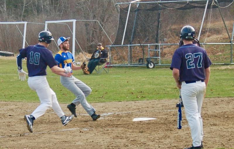 A Dirigo player comes home on a passed ball. ART MAYERS/Boothbay Register