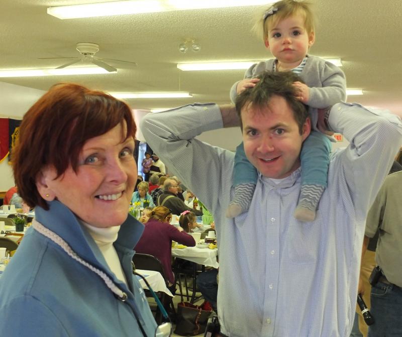 Rotarians Alice Mutch and Jonathan Tindal (holding daughter Cora) were among the over 220 diners at the 23rd annual Rotary/Watershed Soup Bowl supper held April 11 at the Boothbay American Legion Hall. BILL PEARSON/Boothbay Register