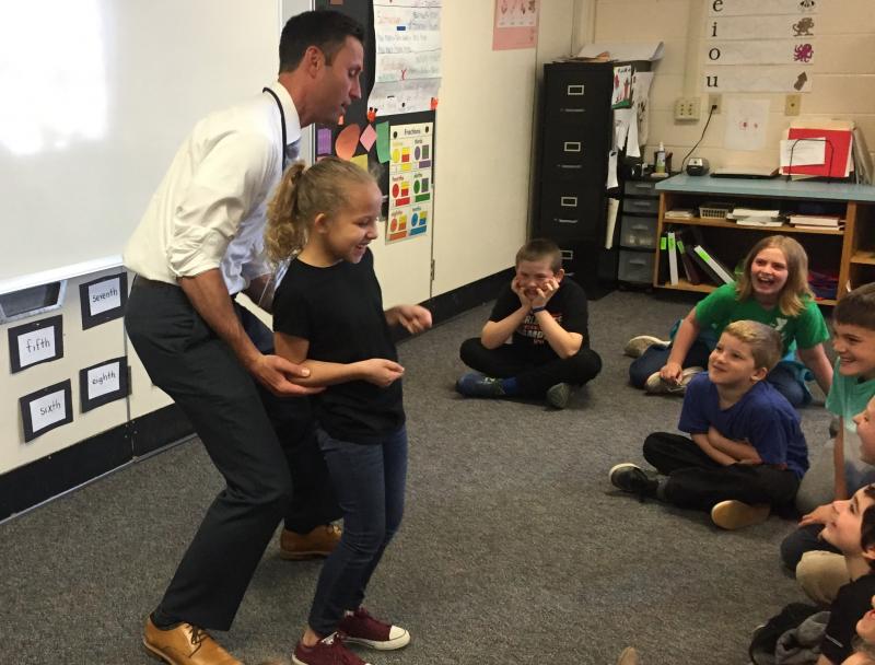 News Center meteorologist Todd Gutner uses third grader Ariyah Green in a weather demonstration May 9 during a lesson for Boothbay Region Elementary School third through fifth graders. BILL PEARSON/Boothbay Register