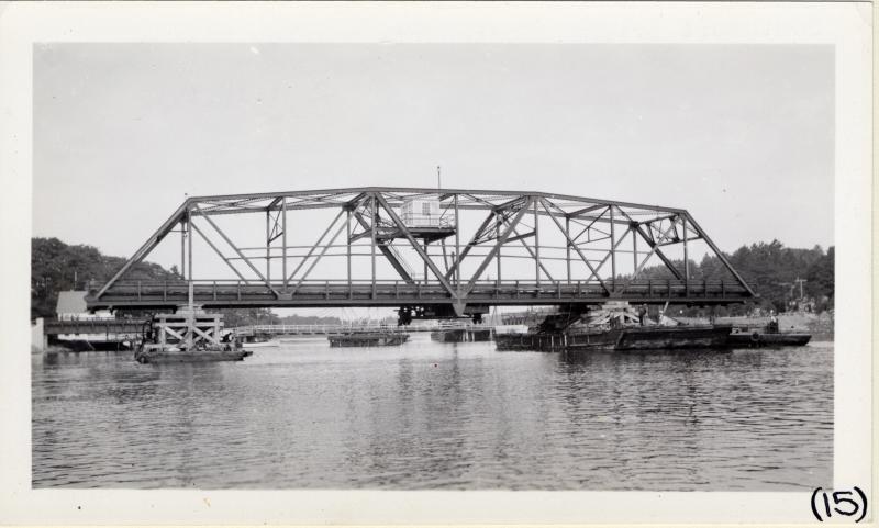 The swing span is drifted into place. Courtesy of MDOT historic bridge archives
