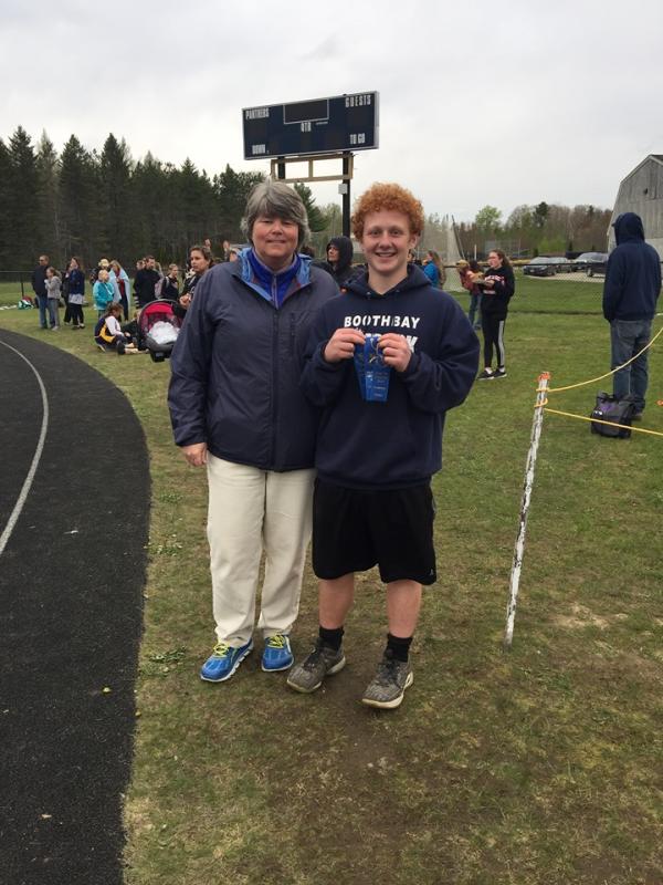 Eighth grader Kayden Ames has benefited from Coach Mame Anthony’s tutelage in recent years. Ames won all three events —shot put, turbo javelin and discus — May 23 at the middle school meet in Waldoboro. Courtesy photo