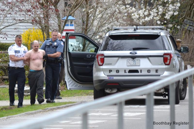 Chief Bob Hasch, left, and Officer Aaron Beck escort Konstantinos Rigas to the police car after the standoff. JOSEPH CHARPENTIER/Boothbay Register