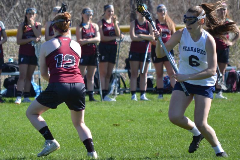 Boothbay’s Chloe Arsenault scored four goals May 6 against Freeport, but it wasn’t enough as the Falcons won, 19-9, at Sherman Field. BILL PEARSON/Boothbay Register