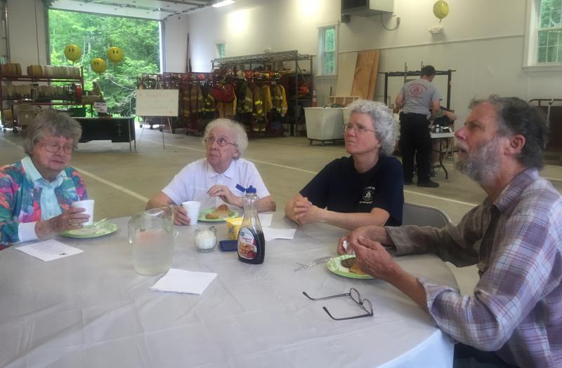 From left, Ruth Bryant, her sister Joan Myatt, Edgecomb Fire Department's chaplain Kate Pinkham and Zip Kellogg enjoy the breakfast. SUSAN JOHNS/Wiscasset Newspaper