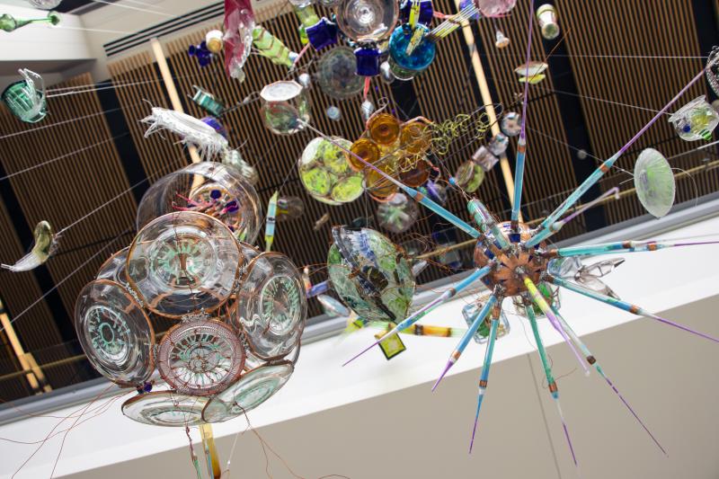 Algae-inspired pieces of glass art hang together in a new installation at Bigelow Laboratory for Ocean Sciences. A special Café Sci event at Bigelow Laboratory on Tuesday, July 9 at 5 p.m. will highlight the work of the artist-scientist team that produced this work, as well the work of several other teams that are fusing science and art. Courtesy of Bigelow Laboratory for Ocean Sciences