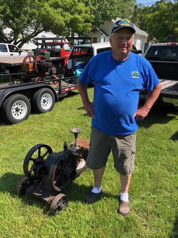Kennebunk's Doug Kimball, president of the Maine Antique Power Association, stands with his 1908 Tom Thumb engine produced by International Harvester. CRAIG LANCASTER/Boothbay Register Railway Village, engines, mechanics, Maine Antique Power Association