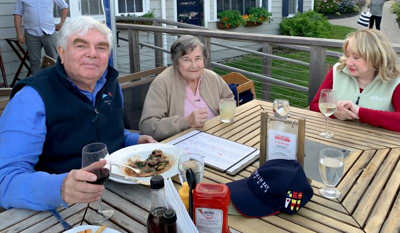 Former owners Peter and Kristina Branch, left and middle, enjoy the food and festivities at Linekin Bay Resort’s 100th anniversary celebration. Courtesy of Erin Stodder