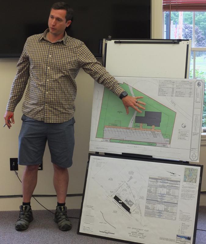 At the July 10 Boothbay planning board meeting, Knickerbocker Group senior architectural designer Randy Smith explains plans for demolishing the former Pinkham’s Seafood building on Route 27 and constructing a new building for making gourmet popcorn and fudge. BILL PEARSON/Boothbay Register