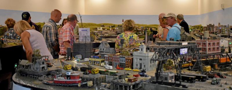 The MRR’s George Paine and Bob Holland describe the layout as “Maine cities and towns of the 1950s, and the railways running through them, just as Ron envisioned it – all with comprehensive block signal and central dispatcher systems, and a ’30s narrow gauge.” The main locales are Portland, Thomaston (Dragon cement), Southport, Monson (narrow gauge) and rural Maine. The Southport fishing village and harbor was named in Ron's memory a few years ago; the North Whitefield hillside village is dotted with memorable structures such as Moody's Diner, the John Deere tractor dealer, and Elm's Boothbay Texaco Garage. The farm villages of Monson. Whitefield and North Whitefield were the towns on Wiscasset, Waterville and Farmington Railroad. “The vision we follow is Ron’s.” noted Paine. “The basic tracks have been running since 2006 with very few problems.” Courtesy of Kate Steed