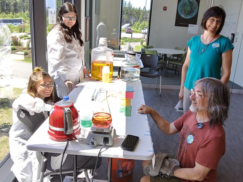 From left, Bigelow Laboratory’s Kate Smith and Kristin Heidenreigh talk ocean science with visitors Renee and Michael Zeleny of Rice, Minnesota. JANE CARPENTER/Boothbay Register