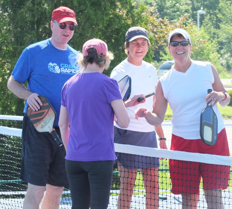 Pickleball players perform a customary handshake following a July 2 match in Boothbay Harbor. BILL PEARSON/Boothbay Register