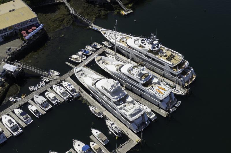 Superyachts dwarf their neighbors docked in the harbor. Courtesy YachtPics