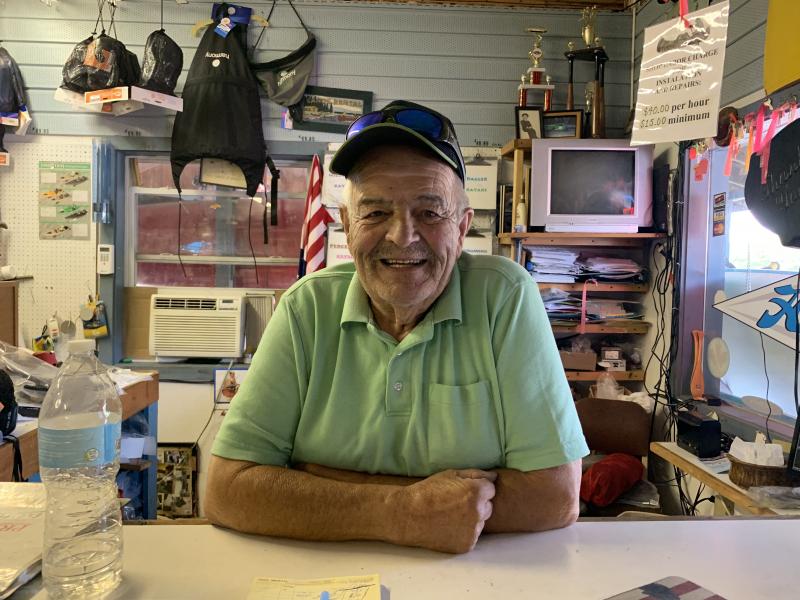 At the counter of his business of 47 years, Wiscasset Trading Post, Bob Rogers talks Aug. 23 about Miss Wiscasset Diner’s past and the diner’s future. SUSAN JOHNS/Wiscasset Newspaper
