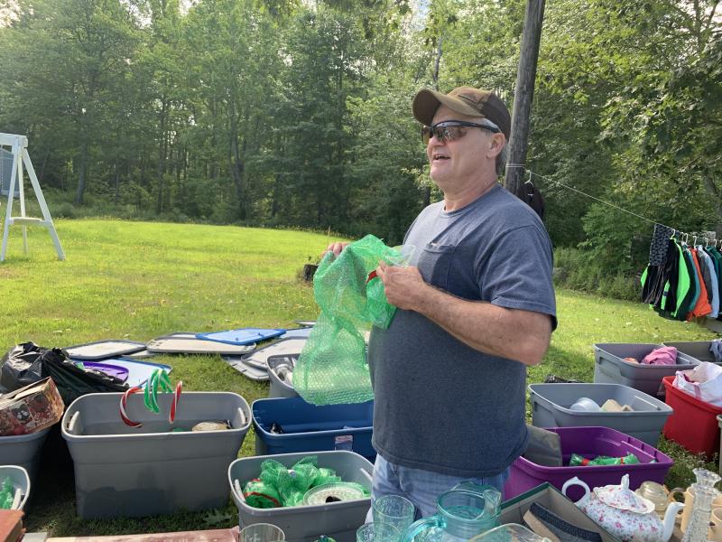 Mark Suarez of Boothbay Harbor puts out more items for sale at the business he and wife Kelley Coady closed last month due to a staff shortage they couldn’t fill. SUSAN JOHNS/Wiscasset Newspaper