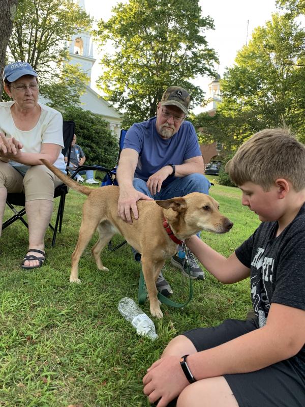 Woolwich’s Marilyn Sprague looks on as husband Gary Sprague and their grandson Wesley Leeman, 12, pat the family’s Carolina dog Merle. SUSAN JOHNS/Wiscasset Newspaper