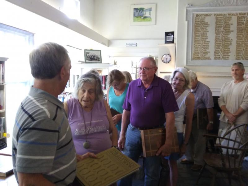 Guests patiently wait for book appraisals by Ken Gloss, far left, at Boothbay Harbor Memorial Library on Aug. 22. JANE CARPENTER/Boothbay Register