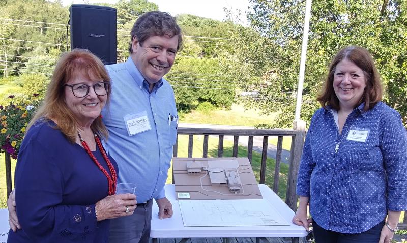 From left, Susan Wilson, project chair, Dr. Chip Teel, founder of ElderCare Network Lincoln County, and Susan Brackett, who led the effort to save the Kenniston Hill Inn, stand next to a model of the proposed Kenniston House campus. JANE CARPENTER/Boothbay Register