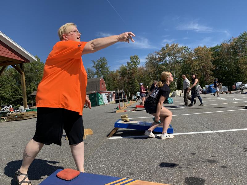 The First National Bank’s Jean Moffatt throws a practice bag at at a cornhole tournament at Ames True Value Supply Sept. 22 to benefit the masons’ Lincoln Lodge in Wiscasset. SUSAN JOHNS/Wiscasset Newspaper