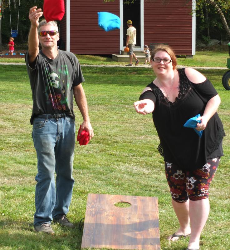 Leo Barter Jr. and Katrina Pearce play cornhole during Family Harvest Days. BILL PEARSON/Boothbay Register