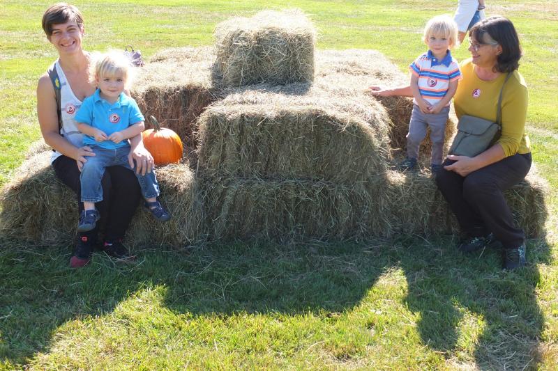 The Beauregard family from Colorado attends Family Harvest Days on Sept. 21. From left are Theodore Beauregard sitting on mother Virginia’s lap, and Charles sitting on grandmother Kathy’s lap. BILL PEARSON/Boothbay Register