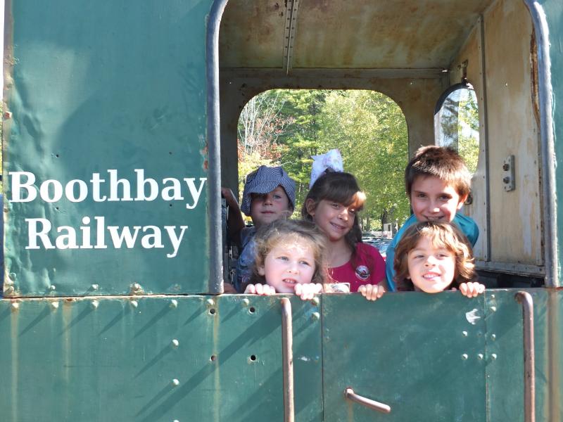 Family Harvest Days had lots of games and rides, but these kids loved checking out a train car Sept. 21 at Boothbay Railway Village. BILL PEARSON/Boothbay Register