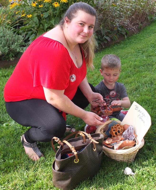 Kaitlin Poland and Travis Finley look though the Bargain Basket Sept. 22 during Family Harvest Days. BILL PEARSON/Boothbay Register
