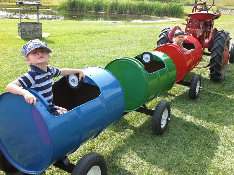 Sept. 22 was a great day for a barrel ride as Leo Barter III and Eloise Hawke enjoy a trip around Boothbay Railway Village. BILL PEARSON/Boothbay Register