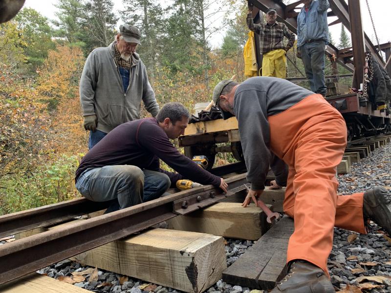 Jason Lamontagne, center, and other volunteers work Saturday. SUSAN JOHNS/Wiscasset Newspaper