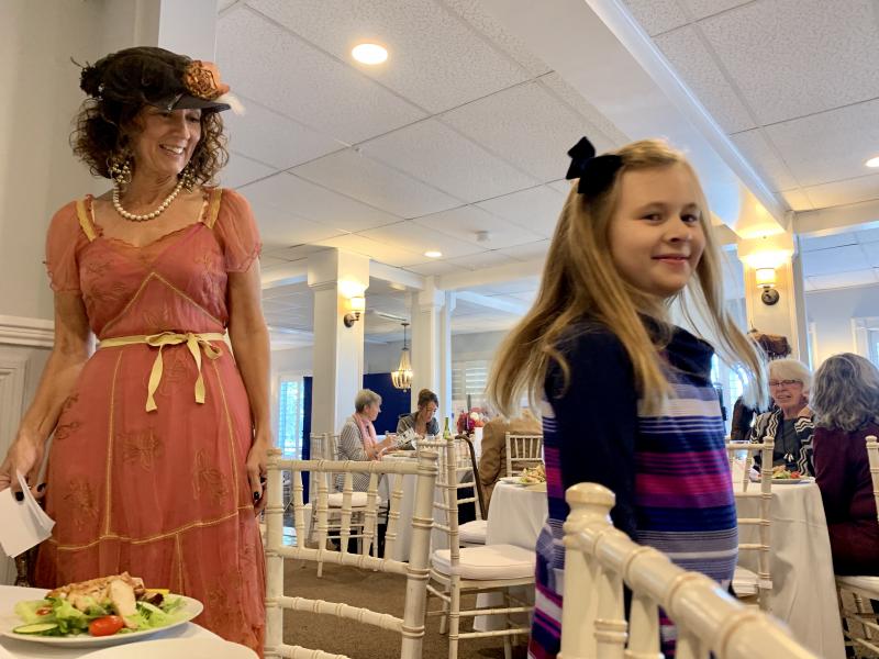 Natalie Dunbar takes a fashionable spin as she and grandmother Sherri Dunbar, left, volunteer as models at a Lincoln County Historical Association fundraiser Oct. 5. SUSAN JOHNS/Wiscasset Newspaper