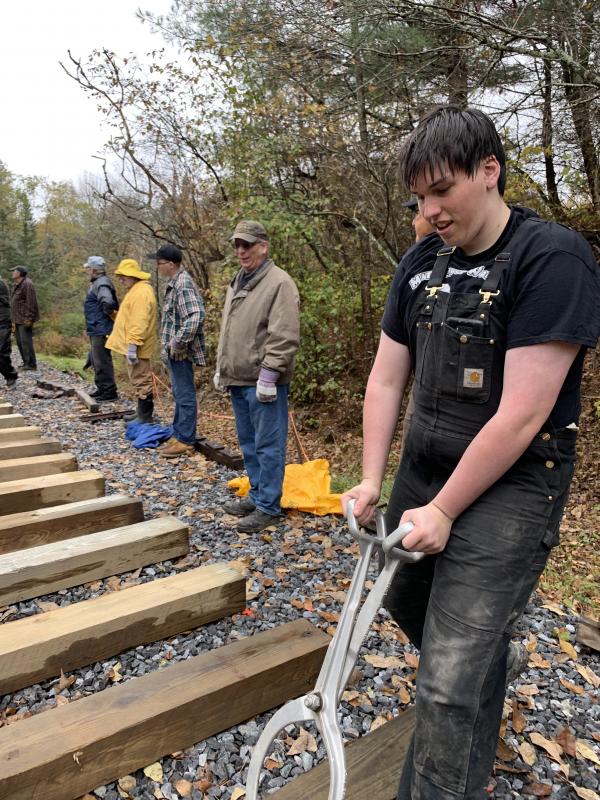 Joseph Gilbert of Cumberland helps place a tie Saturday, Oct. 12. SUSAN JOHNS/Wiscasset Newspaper