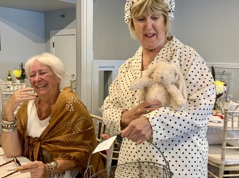 Terry Heller enjoys Terri Wells’ model turn that included saying she insisted she get to hold a toy bunny. SUSAN JOHNS/Wiscasset Newspaper